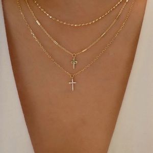 Diamond cross three tiered necklace, gold plated.
